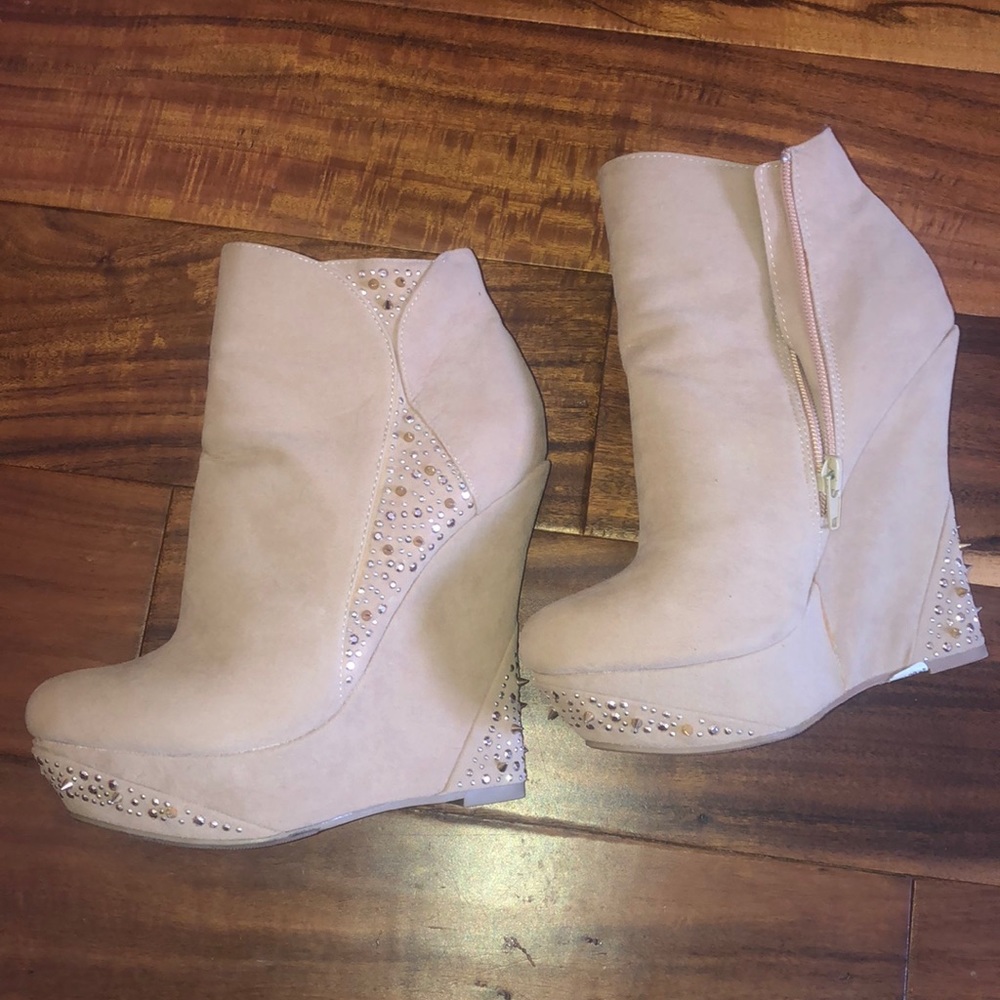 Tan wedges with studs and gold embellishments